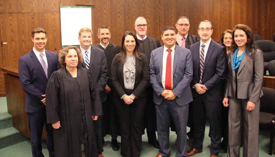 Lawyers admitted to the local bar on December 5: From left, John Himes, Judge Butts, Brandon R. Griest, Judge Tira, Morgan M. Madden, Judge Linhardt, Christopher S. Bradley, Judge Lovecchio, Lee A. Fry, Judge McCoy and Devin V. Walker.
